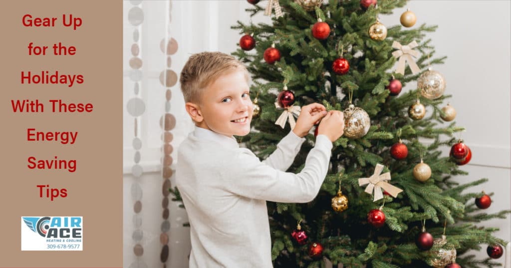 Boy decorating a Christmas tree
